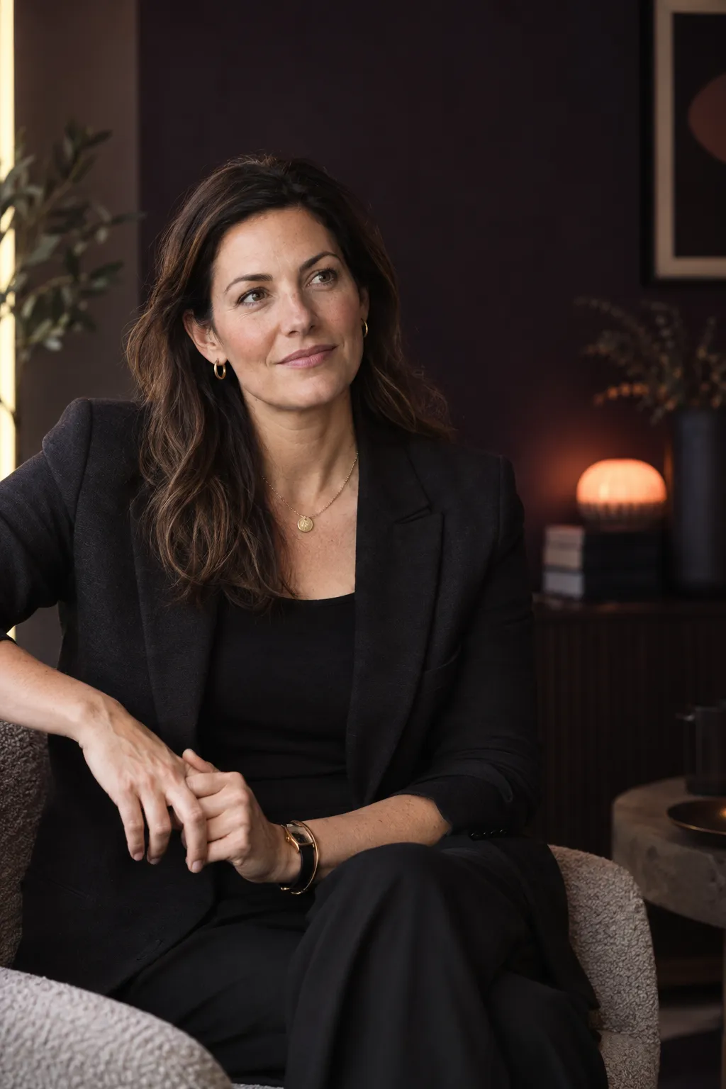 Portrait of a marketplace founder seated in a warmly lit office